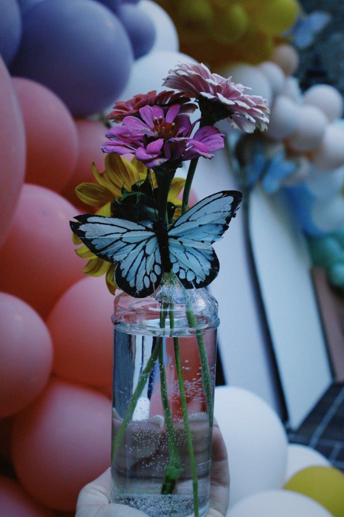 butterfly on flowers in vase